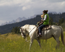 Mother and Child Enjoy Horse Riding Together at Triangle C Ranch