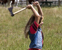 A Young Girl ha Fun Learning How to Throw a Tomahawk at Triangle C Ranch