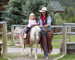 Josie Helping A Little Girl Ride A Mini Horse